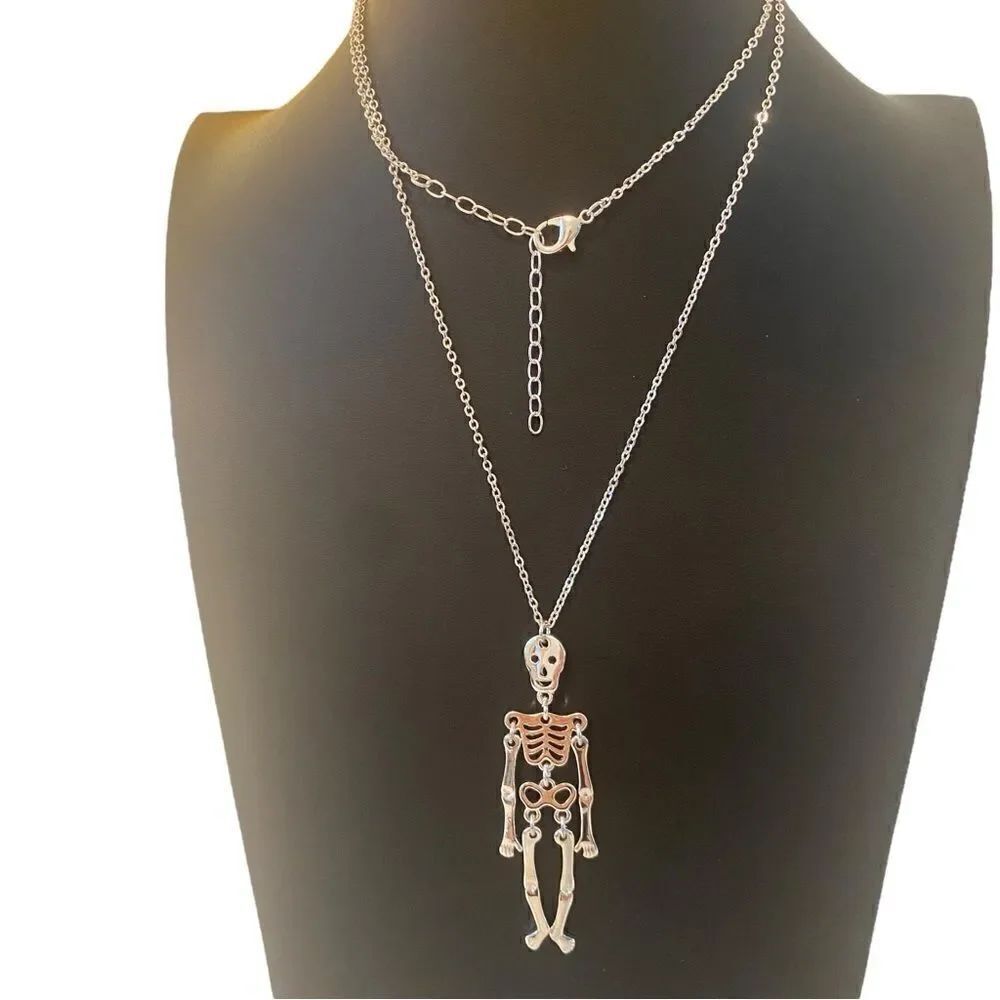Bright Silver Skelton Pendant w/ Moveable Parts on Extra Long Chain.